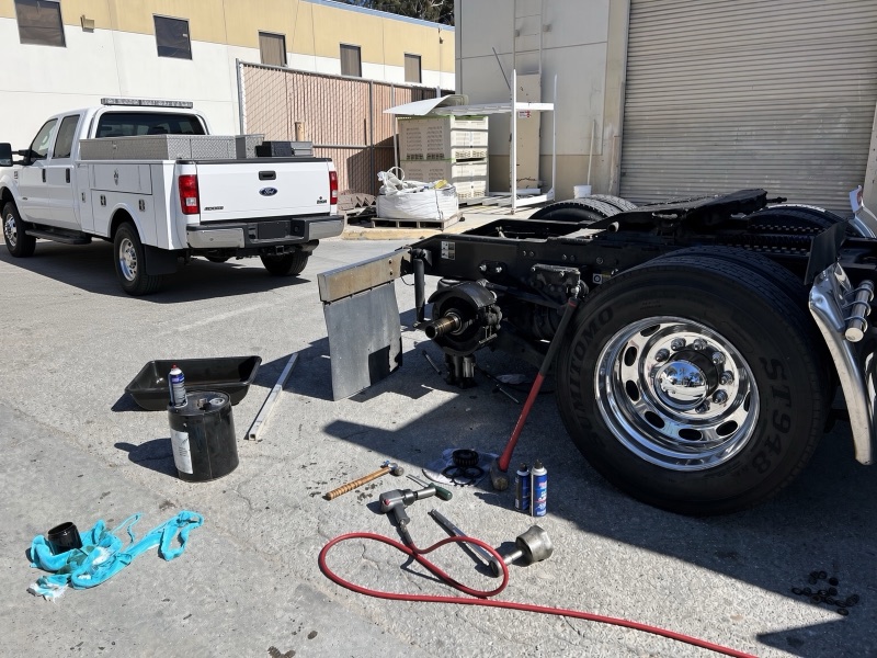 RES Heavy service truck on site for a semi truck wheel and hub job at a commercial yard